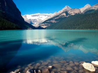 Explore the pristine shores of Lake Louise, a luxurious base camp for a tour of the Canadian Rockies.