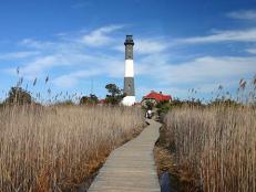 Toward the eastern end of New York's Robert Moses State Park, is the 1891 black-and-white ringed Fire Island Lighthouse.