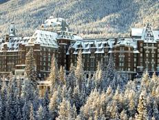 Snow-covered trees surround the luxurious Banff Springs Hotel in the heart of the Rocky Mountains.