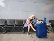  'Couple sleeping in airport'