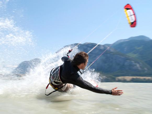  'man kiteboarding, on water'