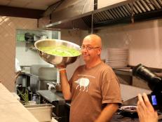 Andrew Zimmern holds pea and watercress puree