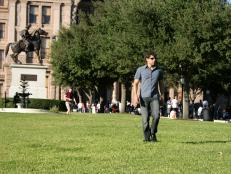 Marcus Sakey walking in front of the Texas Capitol building