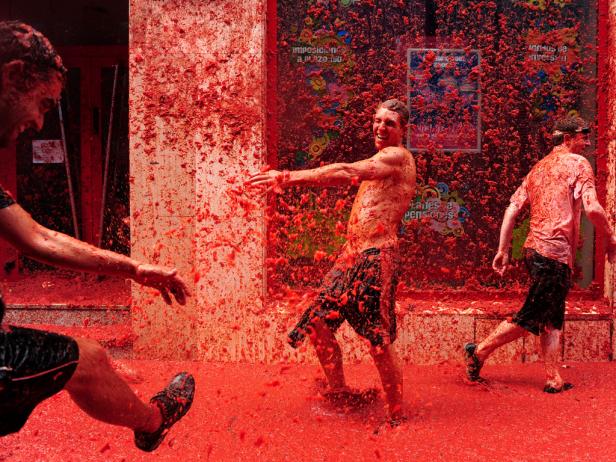 <b>La Tomatina</b> -- <br/>Revellers pelt each other during the world's biggest tomato fight at the Tomatina Festival on the last Wednesday in August, in Bunol, Spain.