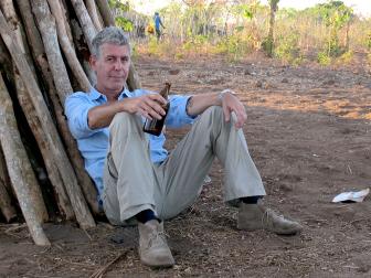 Tony Bourdain with beer in Mozambique