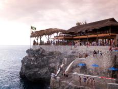 In western Jamaica, hotels and restaurants line the waterfront; fortunately building codes limit structures to the height of a palm-tree and prevent the beach from feeling overdeveloped.