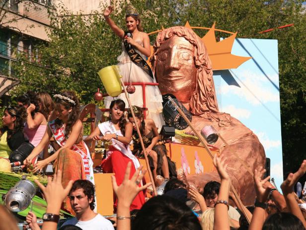 woman stands on float during street parade
