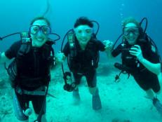 The Lost Girls SCUBA dive and climb Mount Kinabalu.