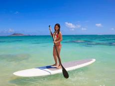 You don't need to be in Hawaii to experience summer's hottest trend: stand-up paddleboarding. An ancient form of surfing, it's now taking off all over the world since you can try it anywhere there’s water -- no waves required. 