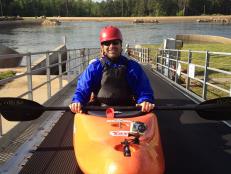 Don Wildman getting ready to kayak whitewater