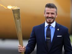 David Beckham Carries the 2012 Olympic Torch