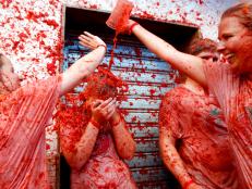 Revelers throw tomatoes on each other during the world's biggest tomato fight at La Tomatina Festival in Bunol, Spain. 