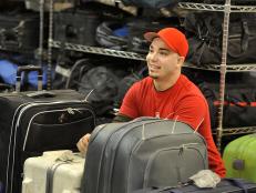 Mark Meyer inspects luggage in Toronto