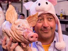 Andrew Zimmern with suckling pig