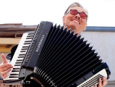 Billy Leroy looks at an accordion