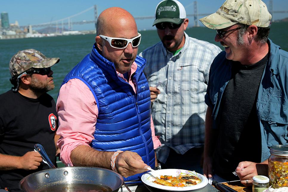 Andrew Zimmern preparing a shark to eat in San Francisco