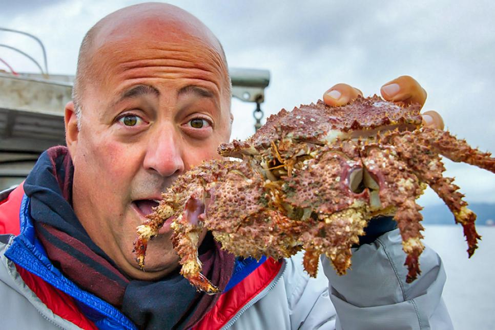 Andrew Zimmern with a box crab in Vancouver