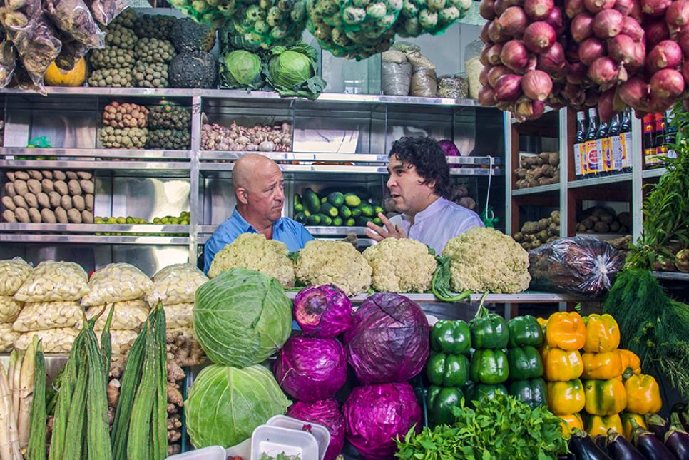 Andrew Zimmern among produce in Lima