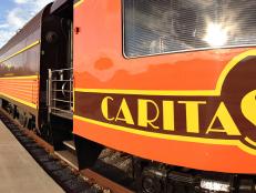  'Close up of Caritas Rail car stopped at station platform.'