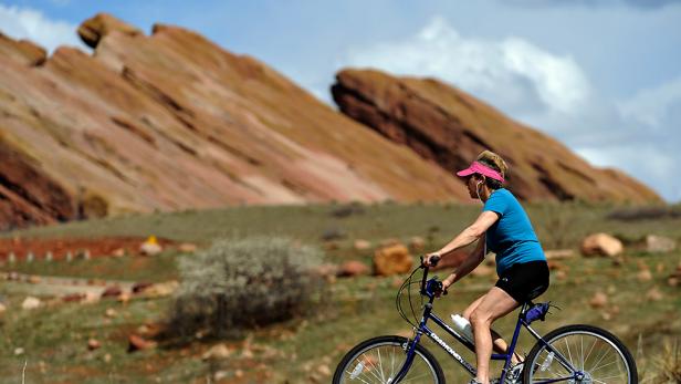 (XX) REDROCK_042309_CFW- A woman rides a bike at Red Rocks Park & Amphitheatre in Denver CO. (Craig F. Walker/ The Denver Post)  (Photo By Craig F. Walker/The Denver Post via Getty Images)