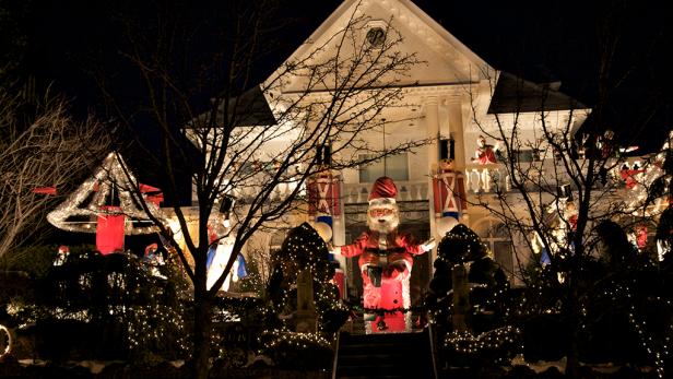 Santa Claus and the nutcrakers at Christmas display in Dyker Heights Brooklyn New York U.S.A.