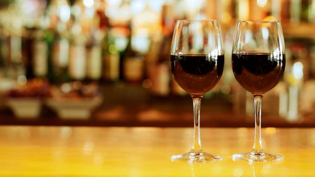  'Close-up of two glasses of red wine on bar counter for Social Wine Bar image'