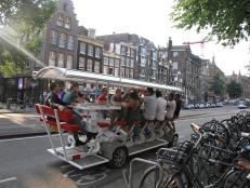 The bicycle bar: "Limo Bike". Jack drinks and cycles. They are cycling down the road.