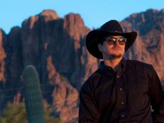 Zak pictured in front of the landscape at Goldfield Ghost Town