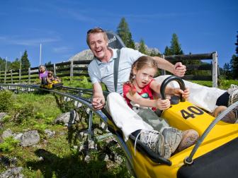 family, father, daughter, low-riding rollercoaster, single carts,