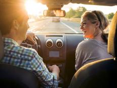 young woman, young man, driving, sunset, road,