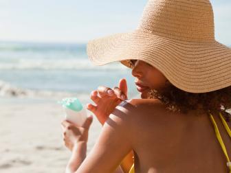 woman, applying sunscreen, beach