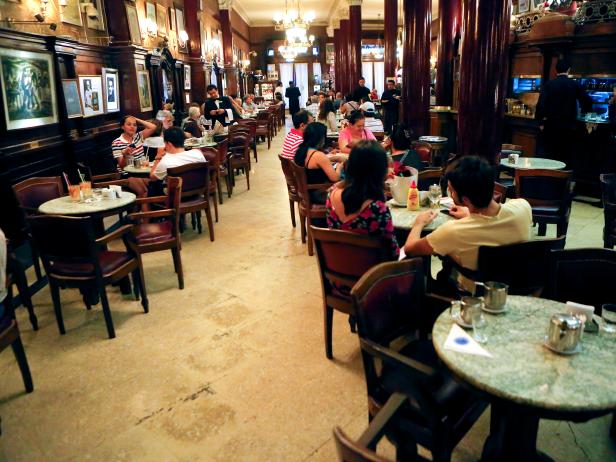 people sit indoors at a classy cafe in buenos aires
