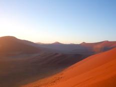 red dunes during sunrise in namibia desert in africa