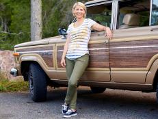 sam brown leaning against a station wagon during the fall