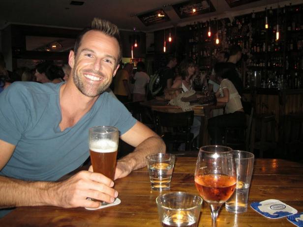 Ewan Porter posing for a picture at a bar