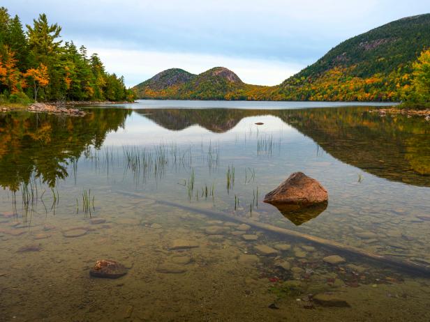 Jordan Pond with reflection ofThe Bubbles mountains, Bar Harbor, Acadia National Park, Maine, USA in Fall season.