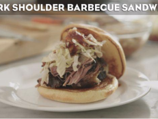 Get the recipe for Andrew Zimmern's pulled pork sandwich inspired by season 9 of Bizarre Foods.