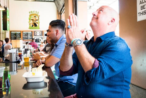 Host Andrew Zimmern sits at a counter at Los Angeles' Eggslut. As seen on Travel Channel's The Zimmern List.