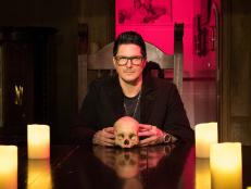 Zak sits at the head of the table inside his Haunted Museum, bracing for what's coming for not only him, but for the entire GAC and the special guests.