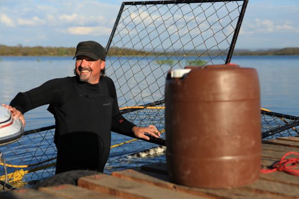 Host Casey Anderson inside of his first crocodile-proof cage, as seen on Travel Channel's Monster Encounters.