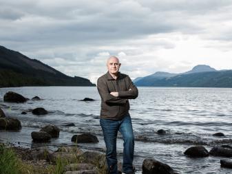 Portrait of professor Neil Gemmell beside Loch Ness, as seen on Beneath The Waves: Solving The Mystery of Loch Ness. (portrait)
