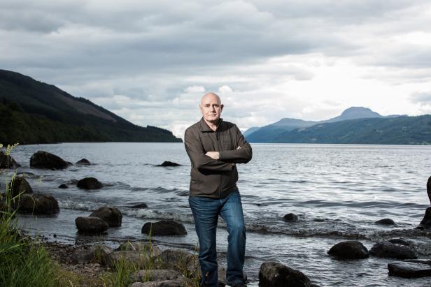 Portrait of professor Neil Gemmell beside Loch Ness, as seen on Beneath The Waves: Solving The Mystery of Loch Ness. (portrait)