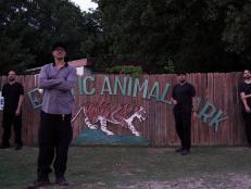 Zak and crew standing in front of entrance sign.