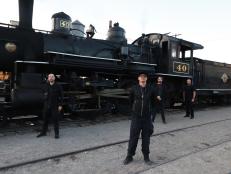 Zak and crew group photo in front the steam train.