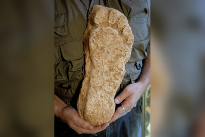 Loren Coleman of the International Cryptozoology Museum displays a cast made from a supposed Bigfoot footprint that was found in Washington state in the 1980s.
