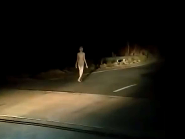 A video of a strange figure walking on a highway at night took both media and social media by storm. The 30-second clip has been shared with the claim that an ‘alien’ or a ‘ghost’ was spotted in India. [screenshot via Deepak]