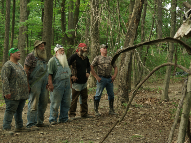 From left to right: The AIMS team members, Jacob “Buck” Lowe, Joseph “Huckleberry” Lott, Jeff Headlee, Willy McQuillian and William “Wild Bill” Neff, examine a skull structure they encountered in the Tygart Valley.