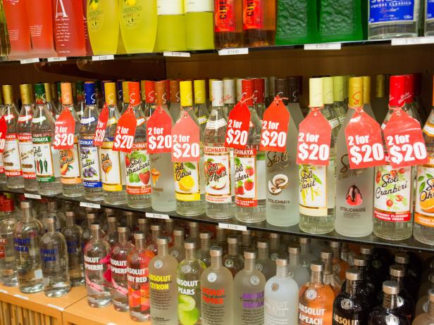 George Town, Cayman Islands- June 20, 2015: Different brands and flavors of vodka are on the shelves in the duty free liquor store in the Owen Roberts International Airport terminal which is located  in the capital city of George Town on Grand Cayman Island. Duty free shopping is available for luxury items such as liquor, jewelry, cigars and perfume. These items can be purchased when you leave the island. The airport is the main international airport for the Cayman Islands.