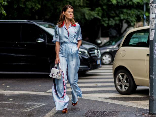 MILAN, ITALY - JUNE 19: Hanneli Mustaparta wearing a babyblue Prada pyjama and white bag outside Prada during the Milan Men's Fashion Week Spring/Summer 2017 on June 19, 2016 in Milan, Italy. (Photo by Christian Vierig/Getty Images)