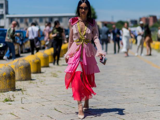 MILAN, ITALY - JUNE 20: A guest wearing a pink dress outside Gucci during the Milan Men's Fashion Week Spring/Summer 2017 on June 20, 2016 in Milan, Italy. (Photo by Christian Vierig/Getty Images)